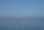 Offshore wind turbines standing in the sea near the coast